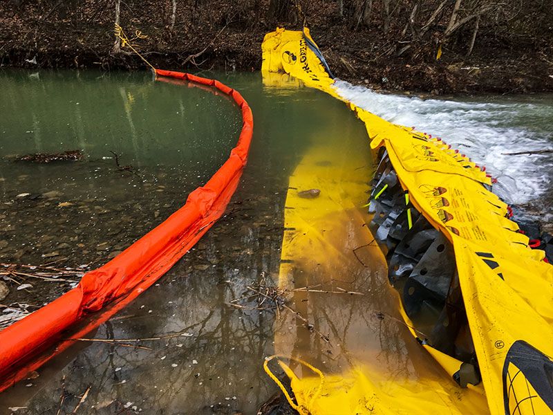 Instant Underflow Dam with oil spill containment booms