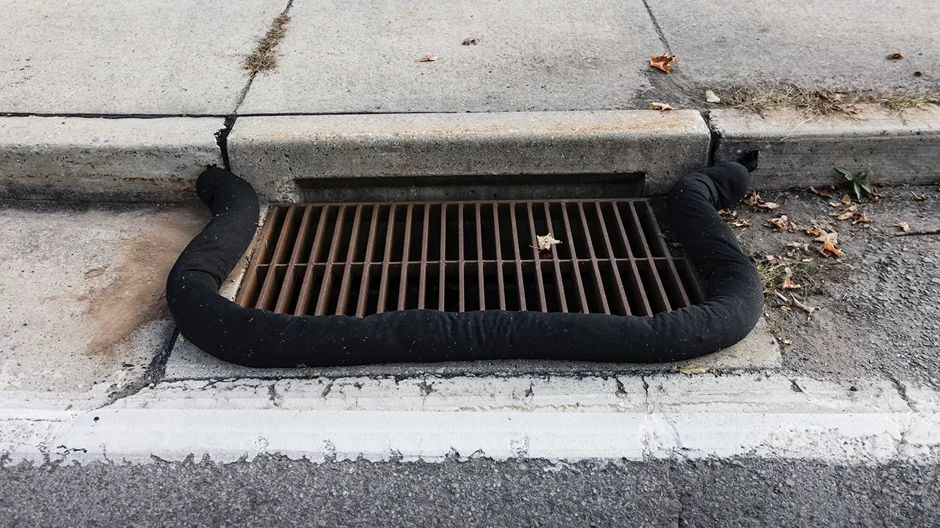 5" x 10' sock effectively containing a 24" x 48 curb-inlet storm drain (SPL066)