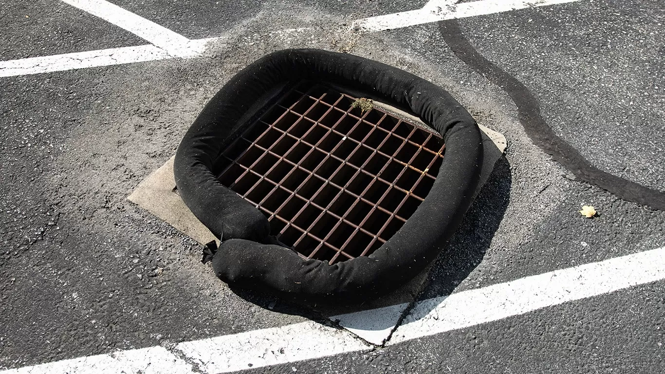 Flexible, 5" x 10' sock surrounding a 24" x 24" storm drain (SPL066)